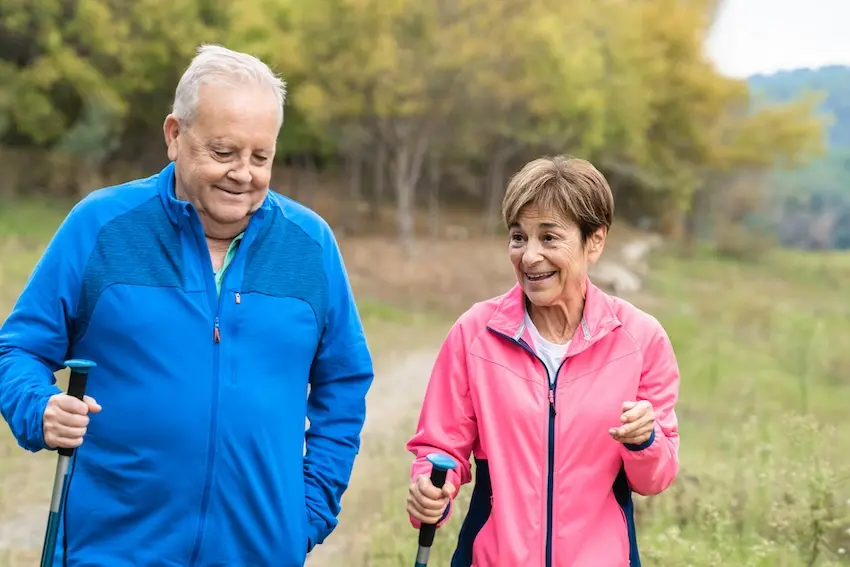 Physical therapist helping patient with therapeutic back exercises for chronic pain relief